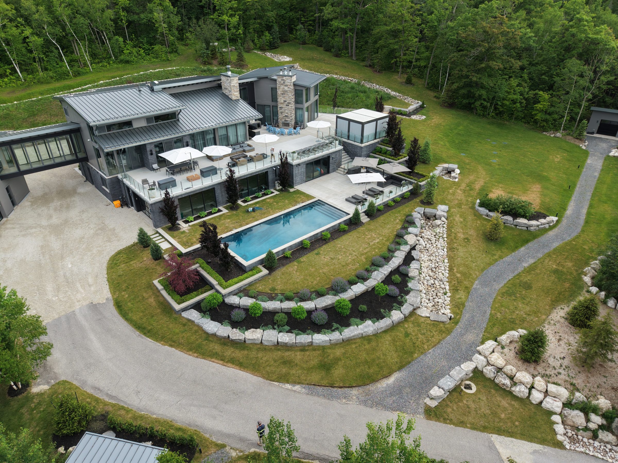 Aerial view of modern home with pool