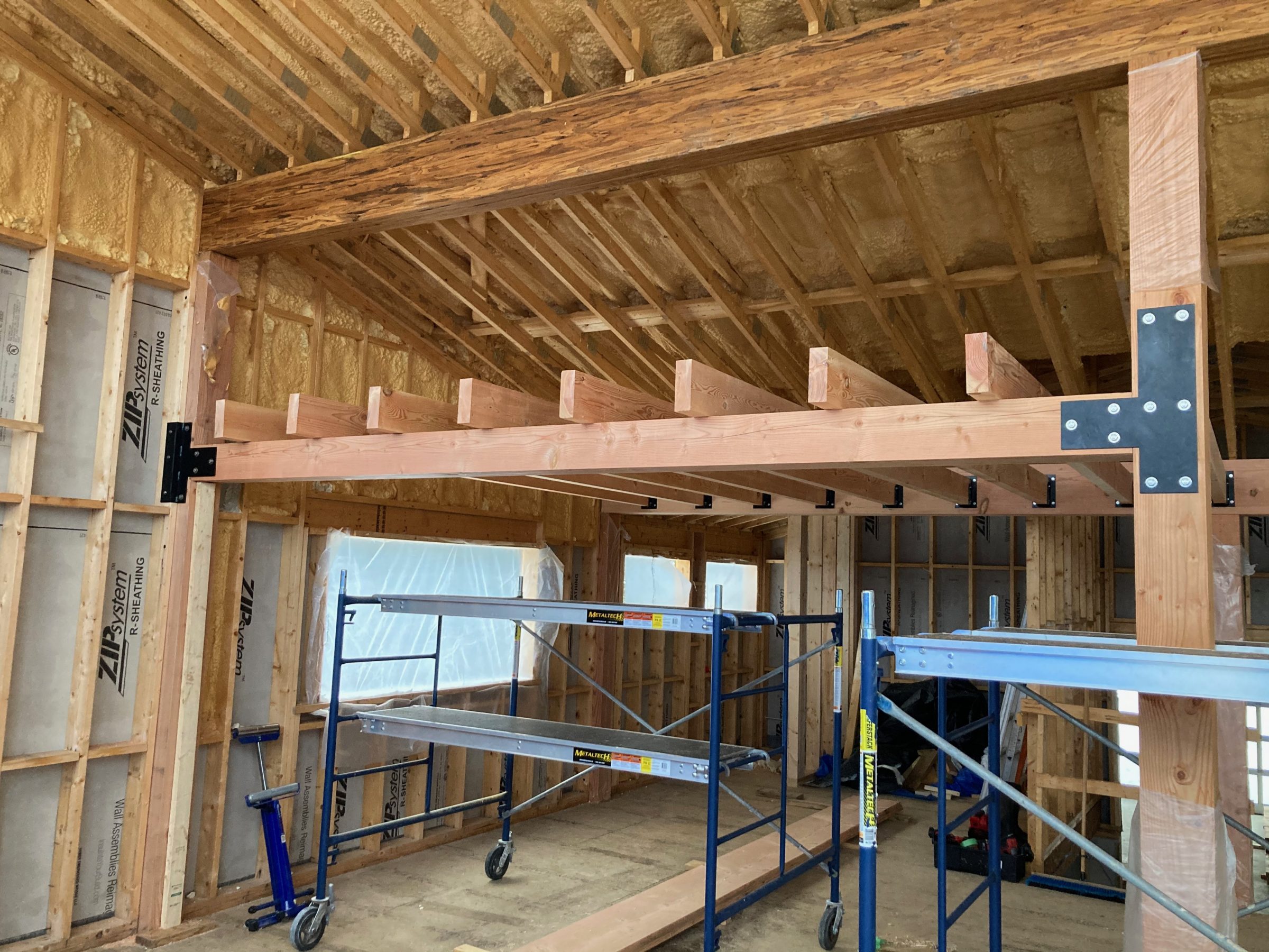 Interior wood framing and beams under construction