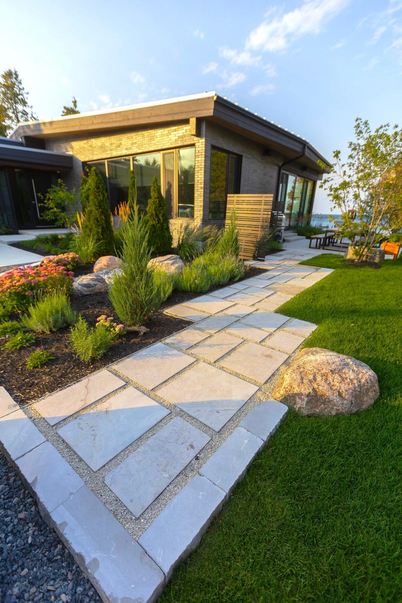 Modern home with landscaped garden and stone pathway