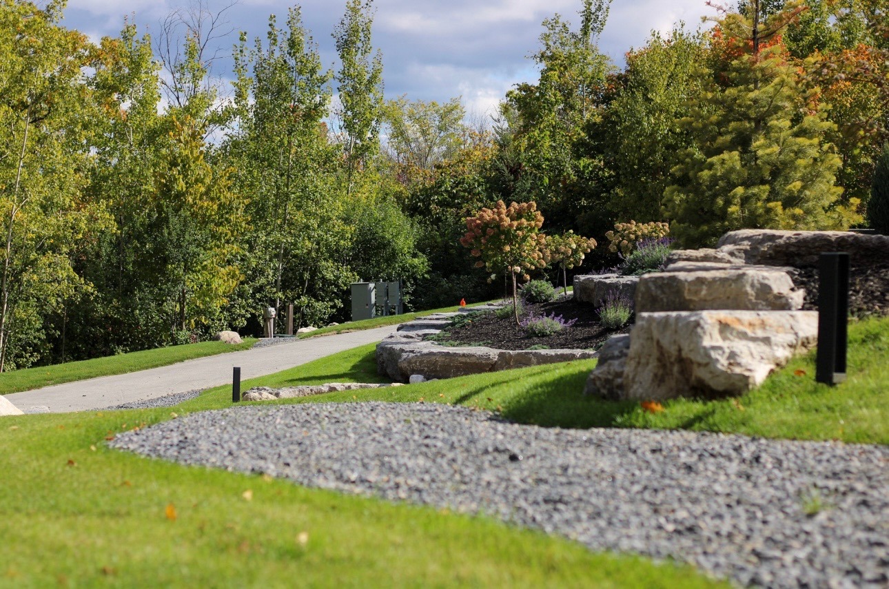 Landscaped garden with winding gravel path and trees