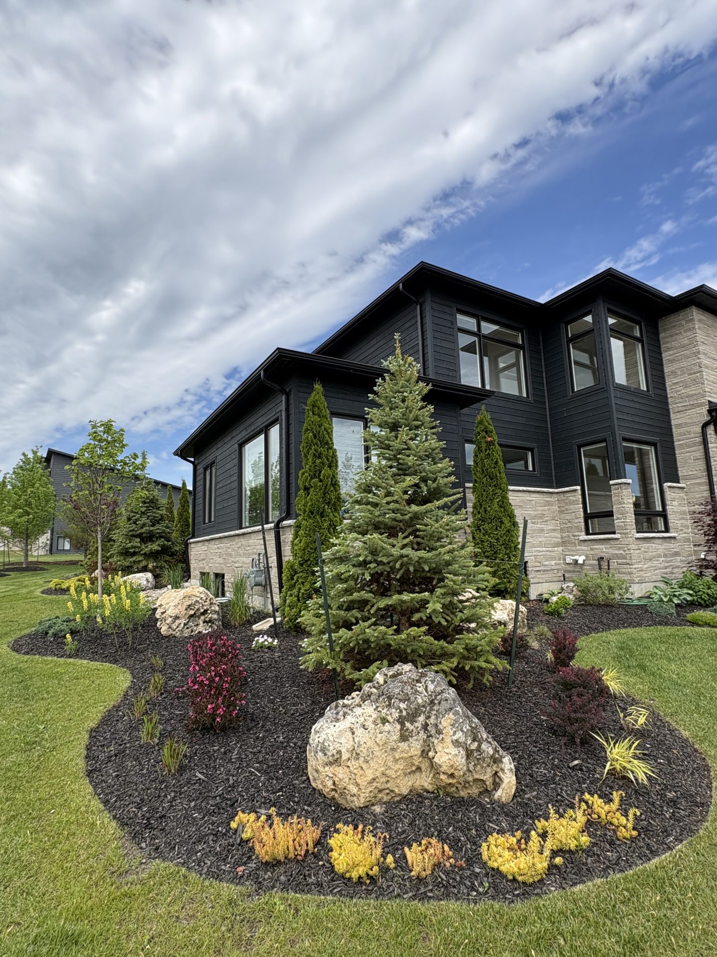 Modern two-story home with landscaped front yard