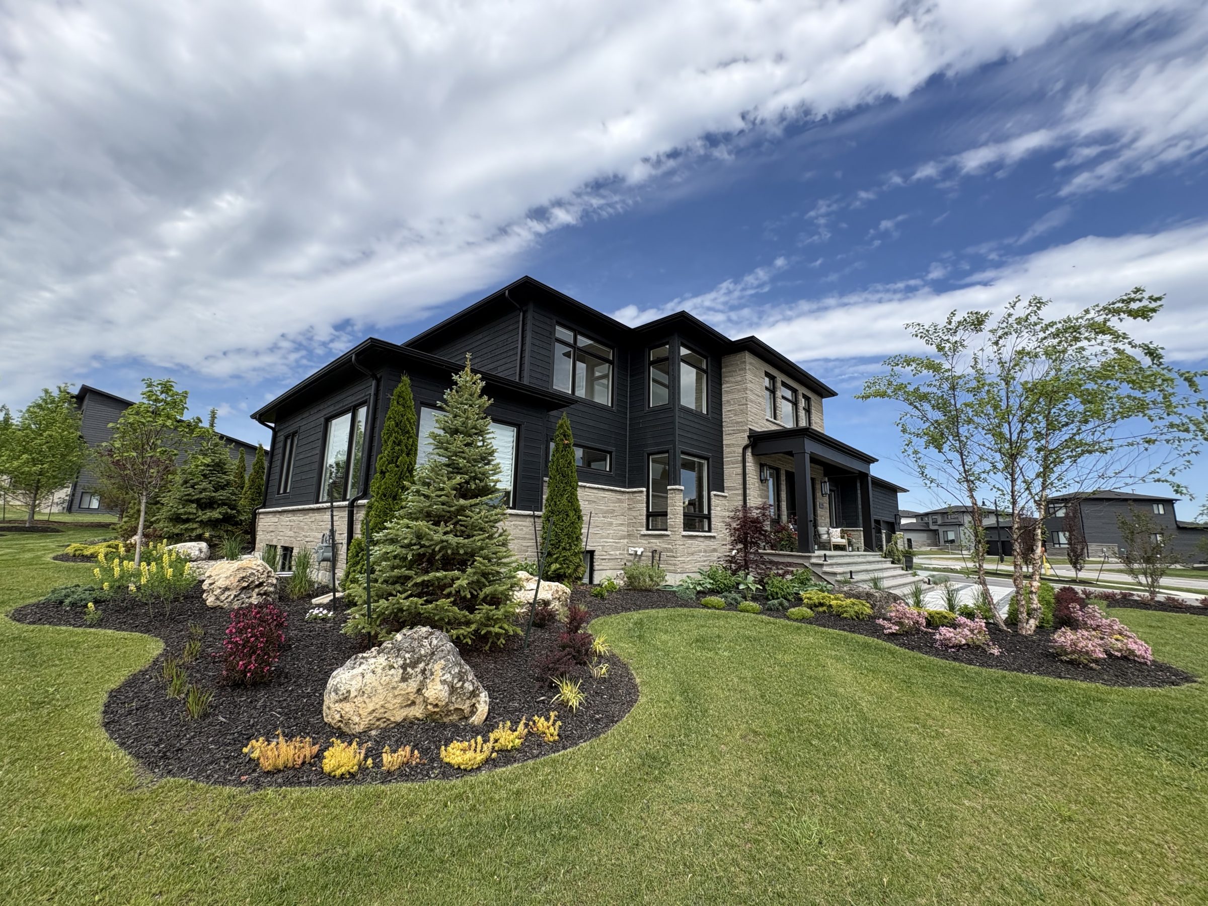 Modern two-story home with landscaped front yard
