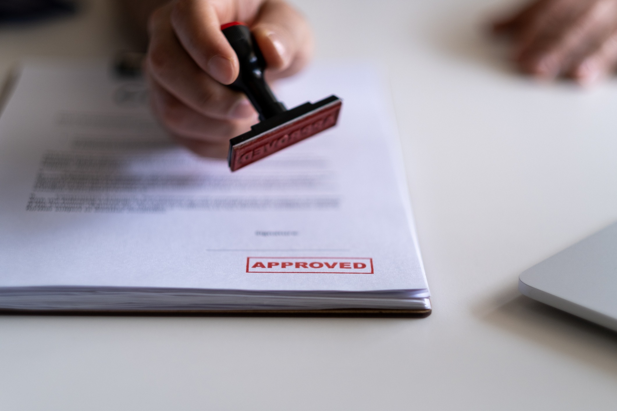 Hand stamping approved on official document