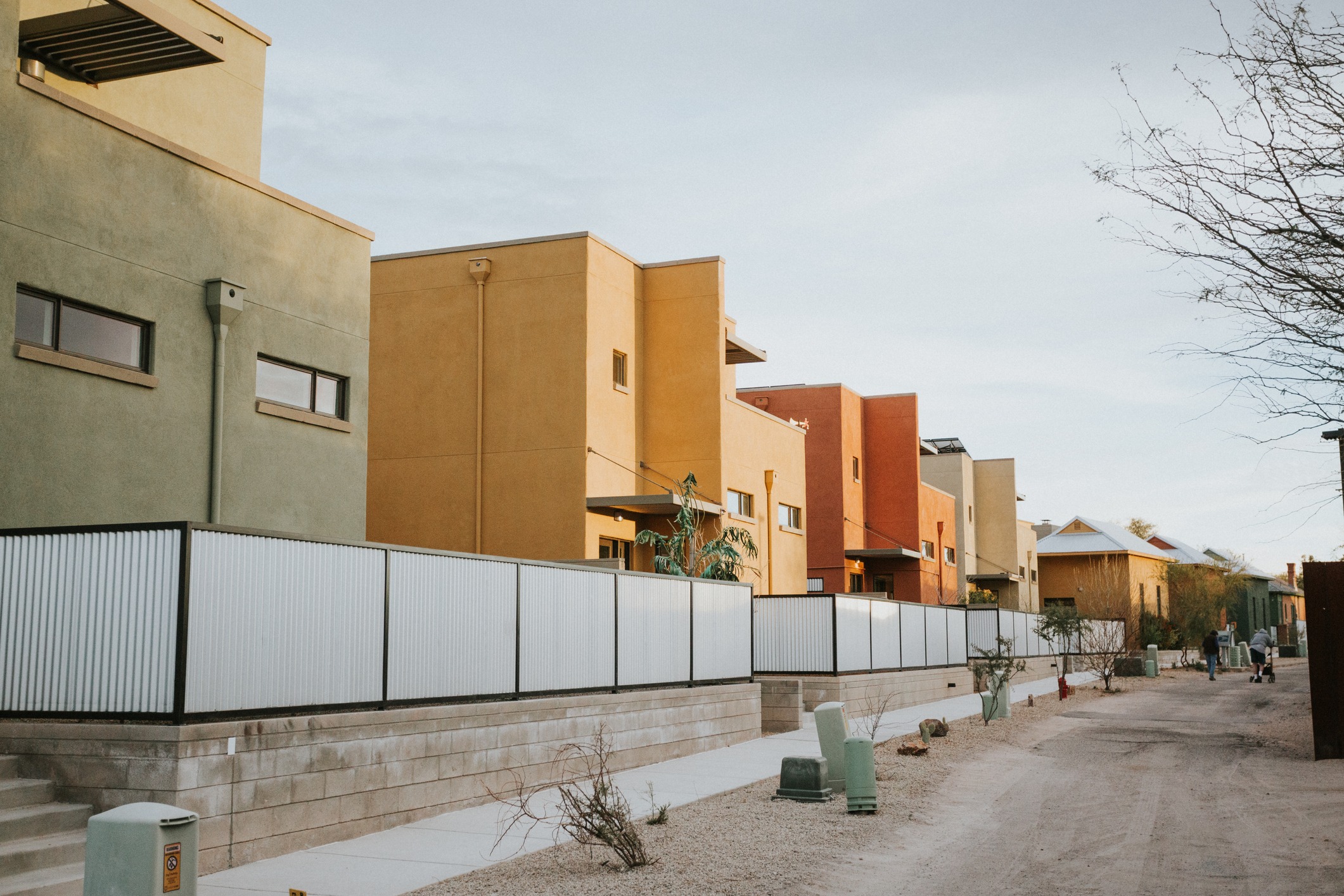 Modern colorful townhouses along gravel alley
