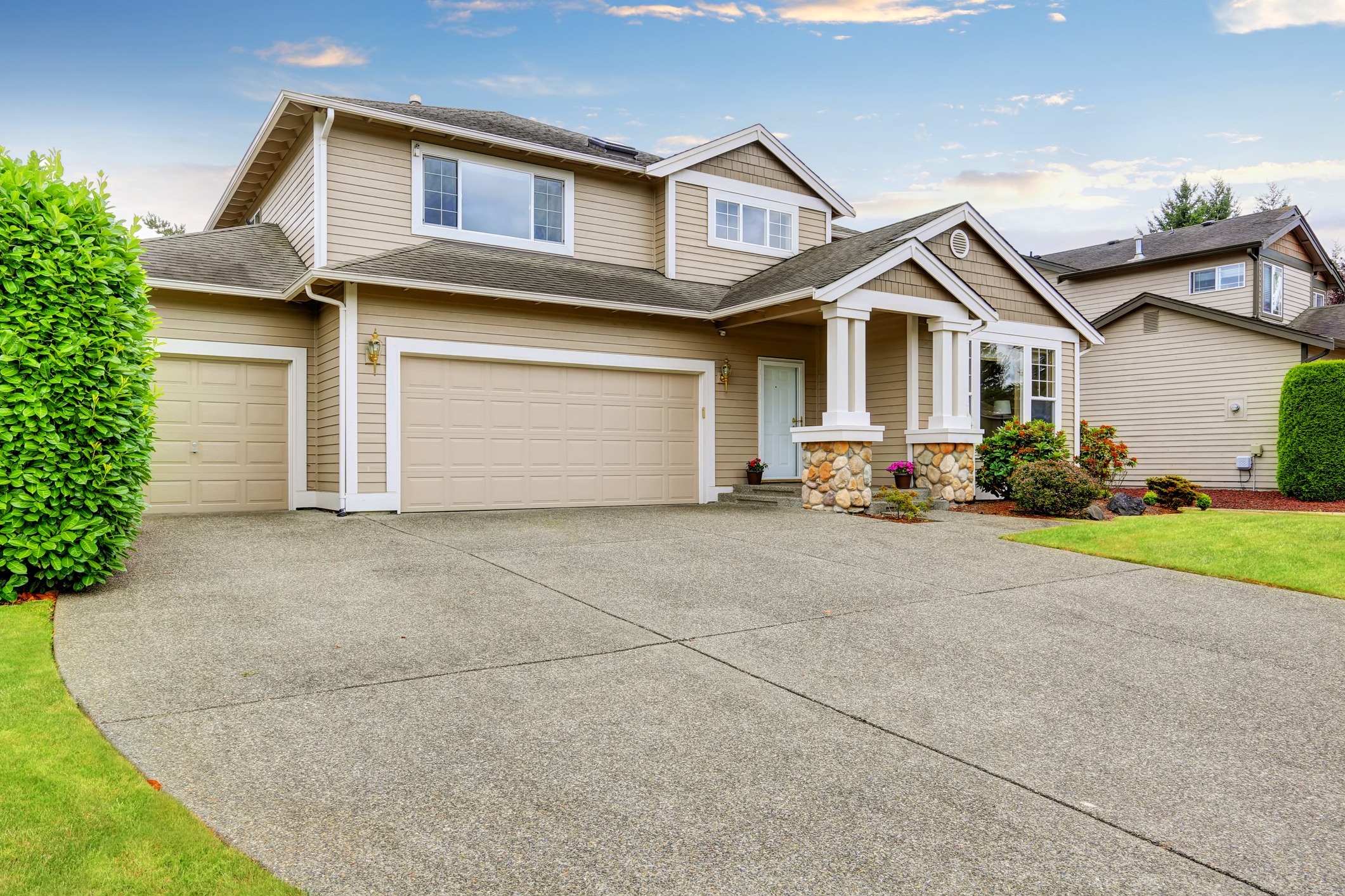 Two-story suburban home with double garage and driveway